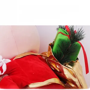 Close-up of Santa Claus plush toy with golden gift bag and realistic pine needles