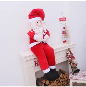 Detail of sitting Santa Claus doll with red suit and white beard on a fireplace mantel