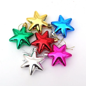 Set of six vibrant shiny star Christmas tree ornaments in gold silver red and blue finishes