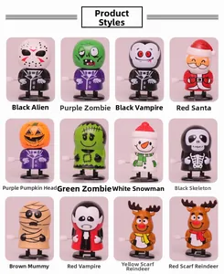Variety of 12 wind-up clockwork toys including Halloween pumpkin and Christmas snowman