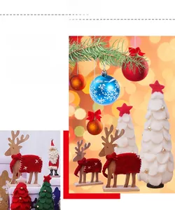 Detalle de reno de madera con fieltro y mini árbol de Navidad decorativo de mesa
