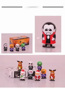 Collection of festive clockwork wind-up toys featuring Halloween and Christmas characters