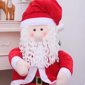 Seated Santa Claus figurine in red velvet with textured beard for Christmas window decor