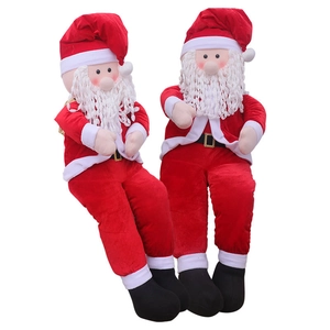 Pair of sitting Santa Claus plush figures with red suits and white beards for Christmas