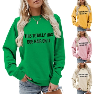 Detail of crewneck sweatshirt showing four available colors with slogan print text