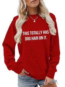 Detail of red crewneck sweatshirt featuring white This Totally Has Dog Hair On It slogan