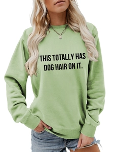 Detail showing the ribbed crewneck and funny slogan print on this light green sweatshirt