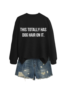 Detail of crewneck sweatshirt with 'THIS TOTALLY HAS DOG HAIR ON IT' white print