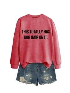 Detail of the crewneck sweatshirt featuring THIS TOTALLY HAS DOG HAIR ON IT text design