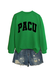 Detail of green crewneck sweatshirt with PACU print and distressed denim shorts