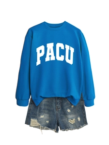Detail of blue crewneck sweatshirt with PACU print and distressed denim shorts ensemble