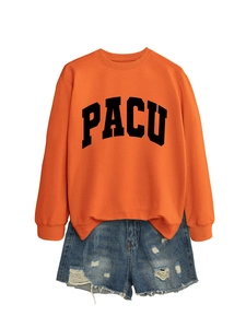 Flat lay of an orange crewneck PACU sweatshirt paired with distressed blue denim shorts