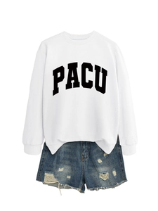 Flat lay of a white crew neck PACU letter sweatshirt paired with distressed blue denim shorts
