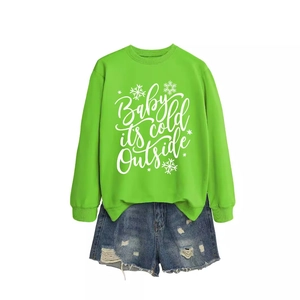 Neon green sweatshirt with snowflake print and distressed denim shorts outfit set