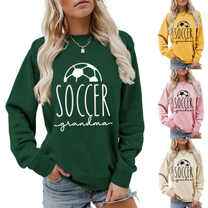 Detail view of soccer grandma sweatshirts in green, yellow, pink, and apricot colors