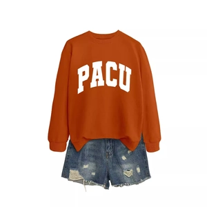 Orange PACU crewneck long sleeve sweatshirt paired with distressed denim blue shorts