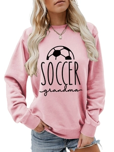 Detail of pink crewneck sweatshirt with black Soccer Grandma print and football graphic