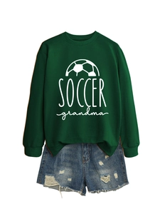Detail view of Soccer Grandma dark green sweatshirt paired with distressed denim shorts