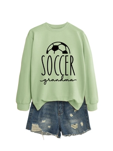Detail view of light green crewneck sweatshirt with black Soccer Grandma print design