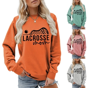 Detail view of colorful Lacrosse Mom sweatshirts in orange, mint, pink, and grey options