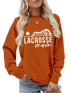 Detail of orange crewneck sweatshirt featuring white Lacrosse Mom sticks and text print