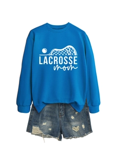 Detail of blue Lacrosse Mom sweatshirt print and distressed denim shorts texture