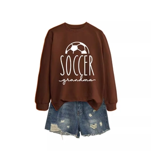 Soccer Grandma printed dark brown crewneck sweatshirt with distressed denim shorts