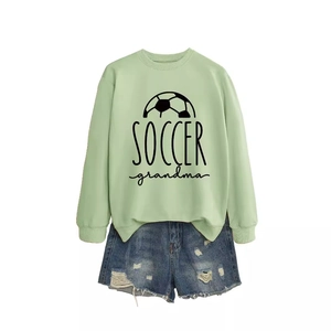 Mint green Soccer Grandma crewneck sweatshirt with football graphic and denim shorts