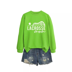 Bright green Lacrosse Mom sweatshirt paired with denim shorts for sporty casual women's style