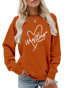 Close-up of ribbed cuffs and wrestling mom print on this orange crewneck sweatshirt