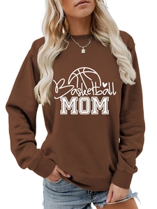 Detailed close-up of Basketball MOM lettering and heart pattern on brown sweatshirt