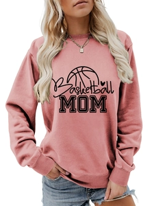 Close-up of Basketball Mom print on mauve crewneck sweatshirt with soft ribbed cuffs