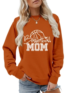 Close-up of Basketball MOM graphic and ribbed cuffs on caramel crewneck sweatshirt