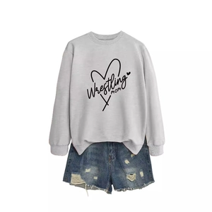 Light gray Wrestling Mom heart sweatshirt paired with distressed blue denim shorts