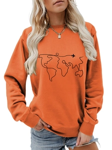 Detail of vibrant orange crewneck sweatshirt featuring a black world map and airplane print