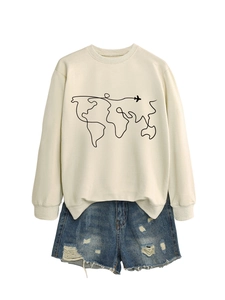 Detail of beige sweatshirt featuring a minimalist world map and airplane print design