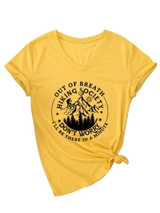 Detail of V-neck yellow T-shirt showing hiking society print and front hem knot design