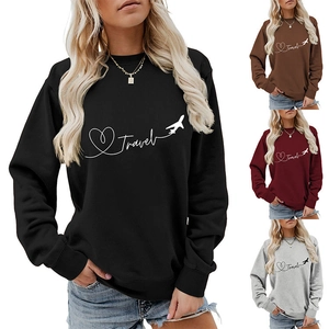 Close-up of Travel print with heart and airplane graphic on crewneck sweatshirt