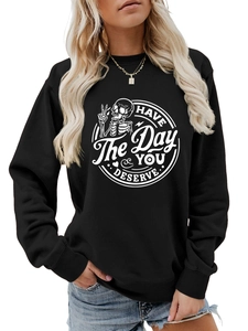 Detail view of cotton sweatshirt with skull graphic and HAVE THE DAY YOU DESERVE print