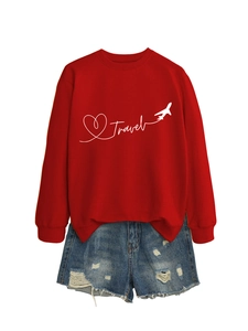 Detail of red crewneck sweatshirt with white Travel text and airplane graphic print
