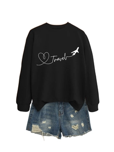 Detail of Travel print on black crewneck sweatshirt with distressed denim shorts