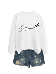 Detailed flat lay of a white crewneck Travel sweatshirt and distressed denim shorts