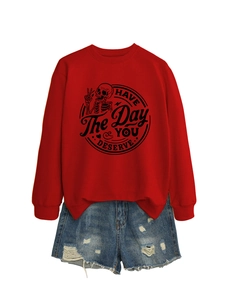 Detail of red crewneck sweatshirt with Have The Day You Deserve skull graphic and denim shorts