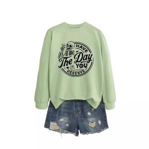 Light green graphic sweatshirt with HAVE THE DAY YOU DESERVE text and denim shorts set