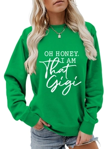 Detail of light green sweatshirt showing white artistic slogan print on soft cotton fabric