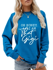 Close-up of royal blue crewneck sweatshirt featuring Oh Honey I Am That Gigi white print
