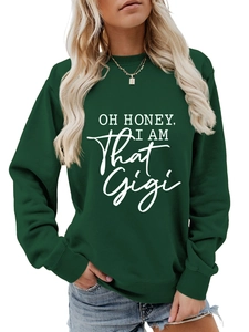 Detail of white slogan lettering on a dark green crewneck sweatshirt with a comfy fit