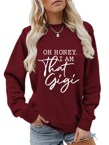 Detail of maroon long sleeve sweatshirt with OH HONEY I AM That Gigi white print art
