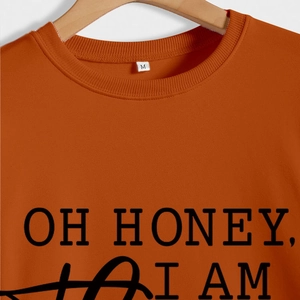 Orange crewneck sweatshirt with OH HONEY I AM THAT GIGI black letter print