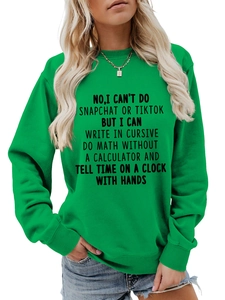 Detail of green crewneck sweatshirt showing high-quality knit texture and text print